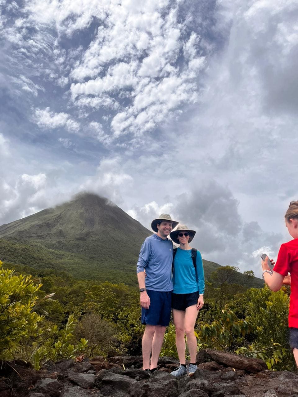 Couple posing on the Arenal Volcano lava trail