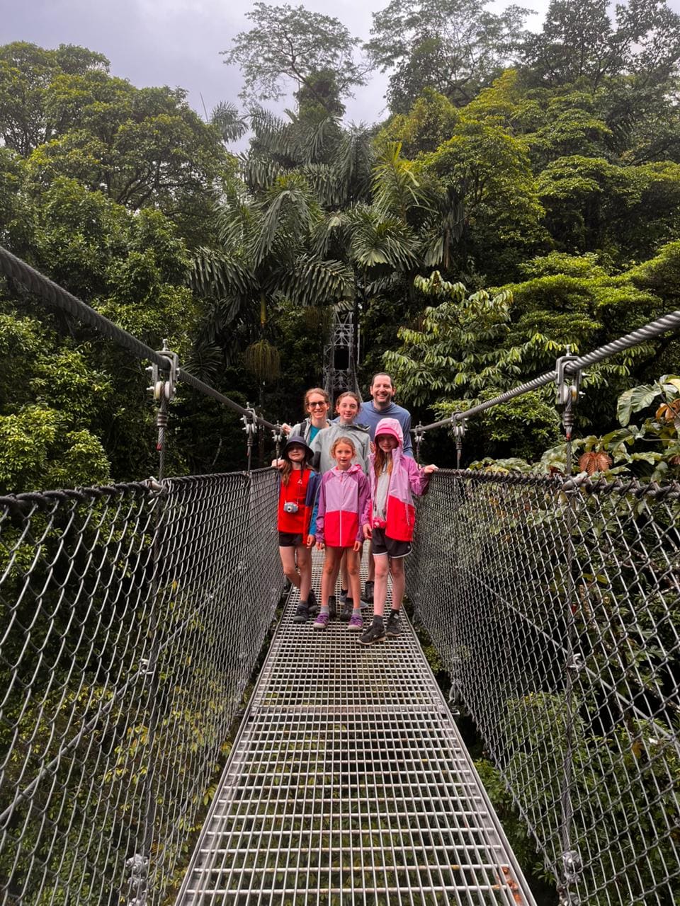Family on a Mistico hanging bridge in the Arenal rainforest