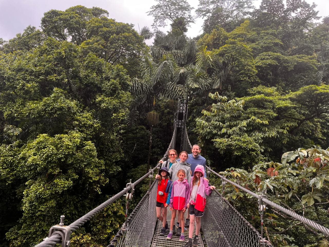 Family enjoying Mistico hanging bridges in the cloud forest canopy